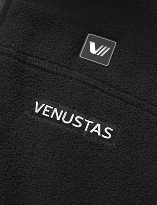 Close-up of the black fleece vest showing the chest logo and soft texture