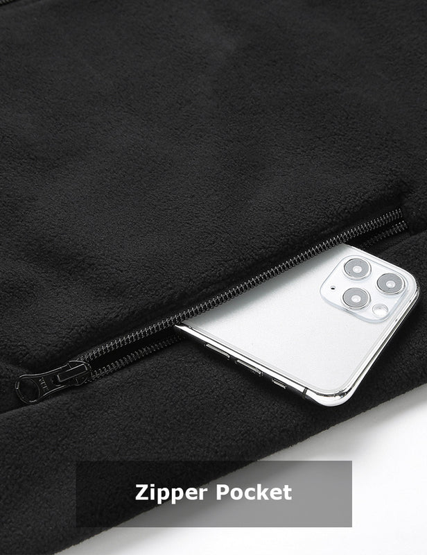 Black heated fleece vest zippered pocket holding a phone