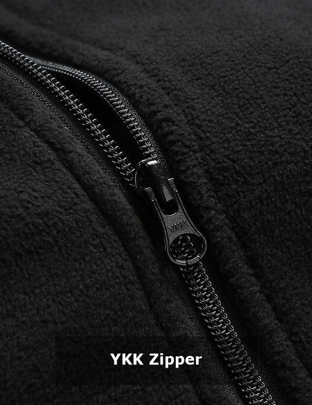Black heated fleece vest close-up showing the YKK zipper