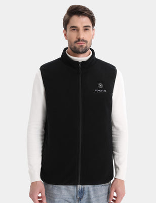 Model wearing black zip-up fleece vest from the front