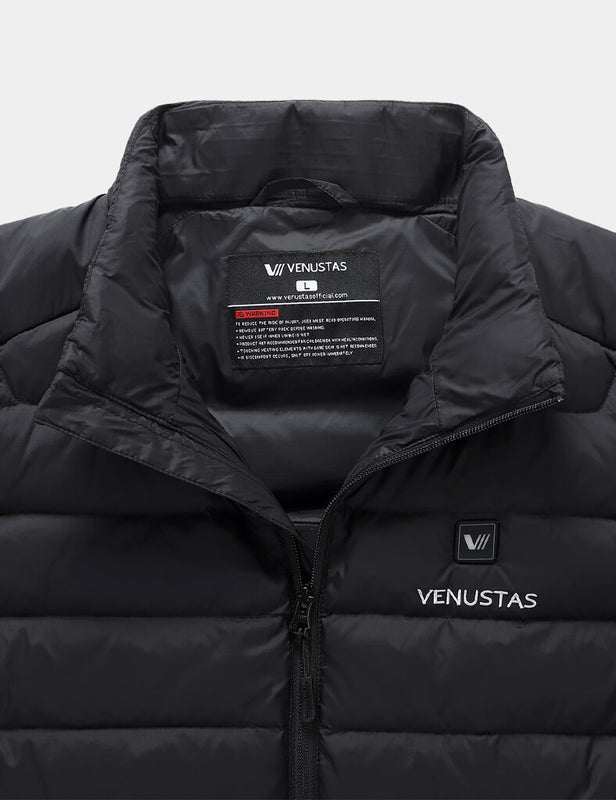Close-up of black heated vest collar with inner label and chest power button