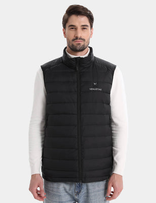 Black heated vest on a model, front view with stand collar and zip closure