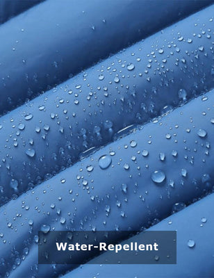 Water droplets on the blue heated jacket shell showing water-repellent fabric
