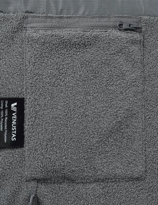 Gray fleece vest close-up showing the zip pocket and recycled polyester fabric label