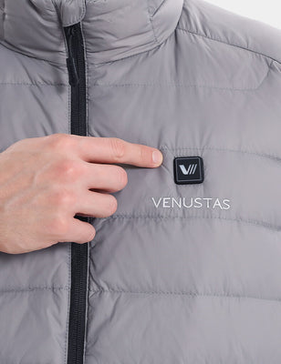 Close-up of gray heated vest chest button being pressed