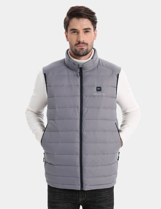 Front view of gray quilted heated vest with hands in pockets