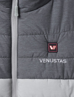 Gray heated vest chest detail with illuminated power button, logo, and front zipper