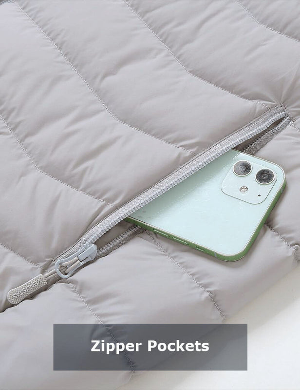 Grey heated jacket zipper pocket holding a phone