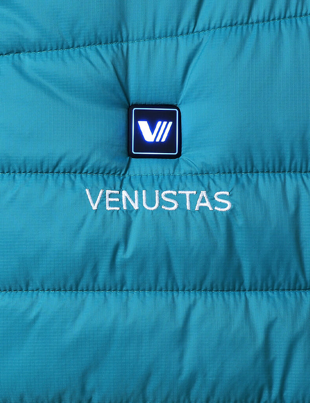 Teal heated vest chest panel with illuminated control button and Venustas logo