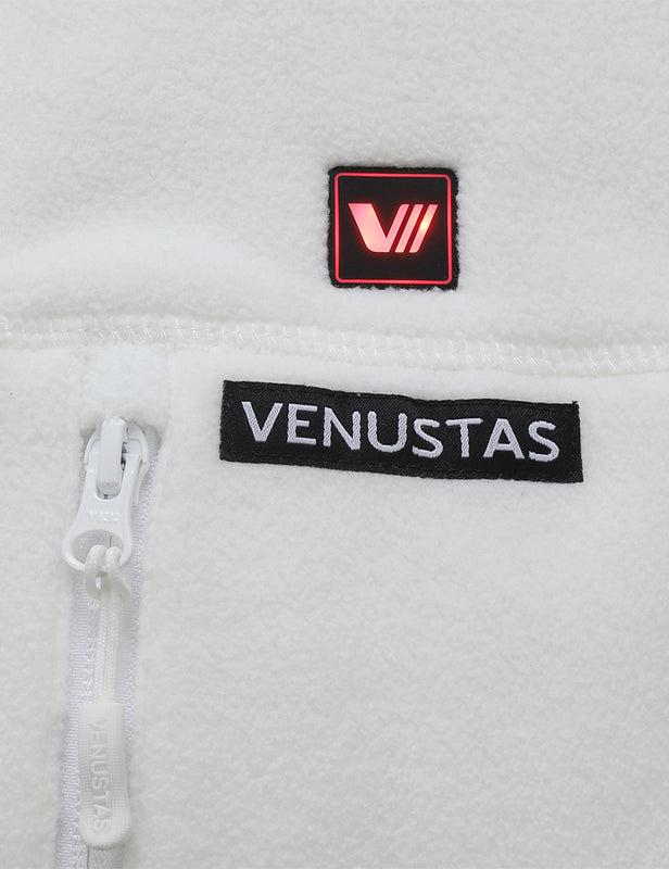 White fleece heated vest close-up with illuminated control button and zipper